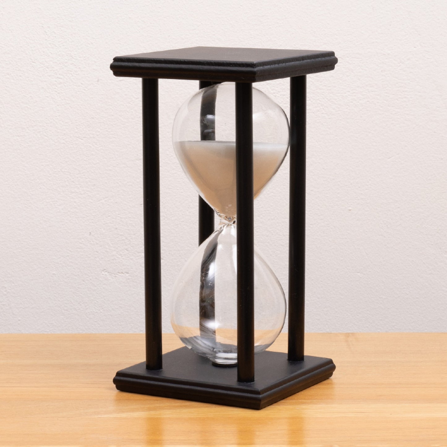 wood frame sand timer with white sand
